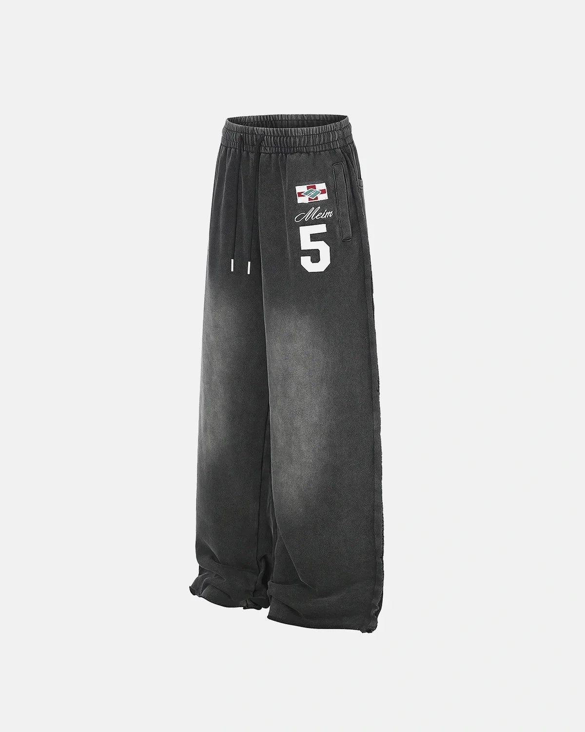 Pantalones deportivos de pierna ancha con estampado lavado
