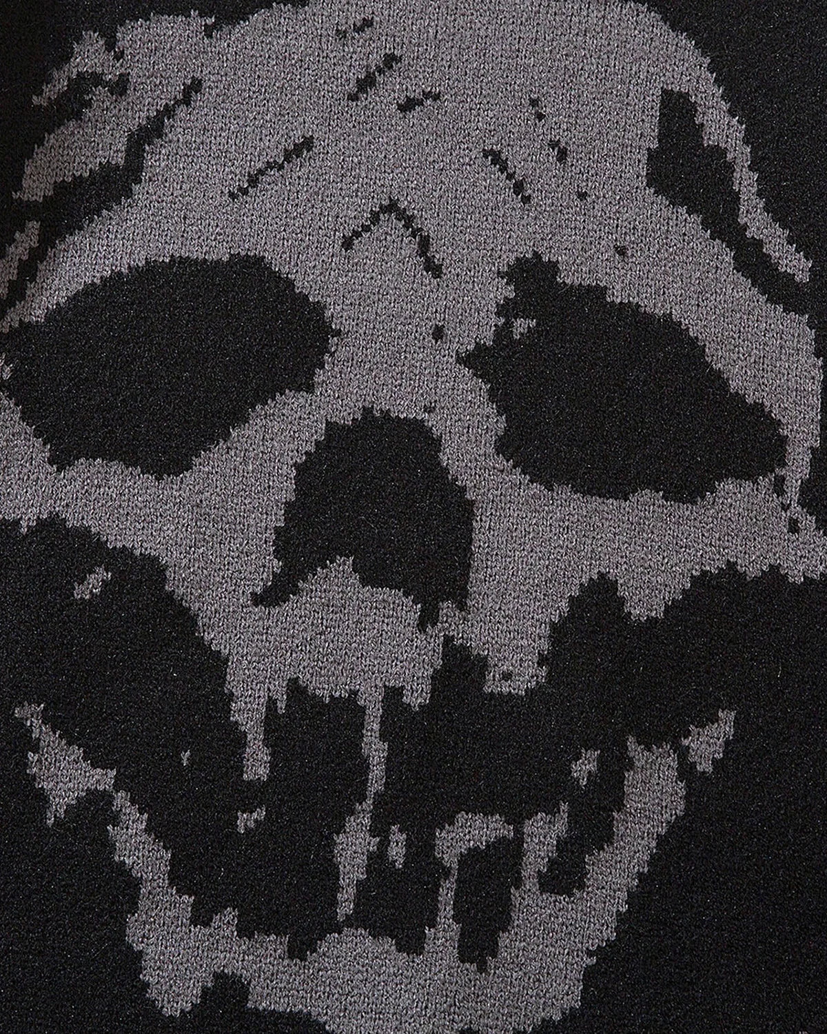 Suéter de punto con calavera desgastada