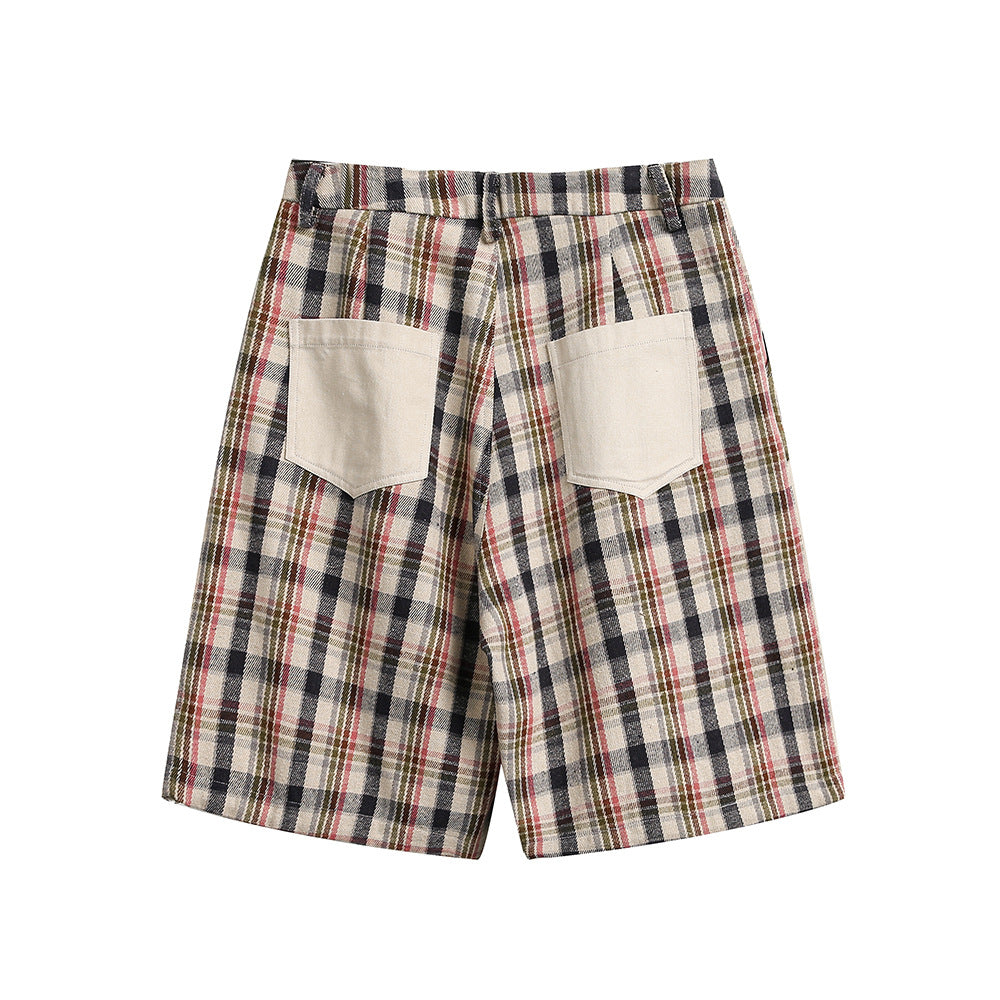 Pantaloni a pieghe ampi e irregolari a quadri, dal design distintivo.