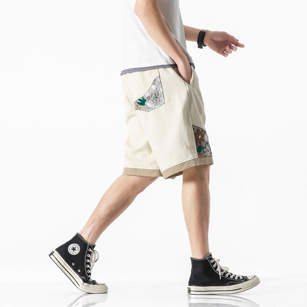 Geborduurde sportshorts met kant en stiksels