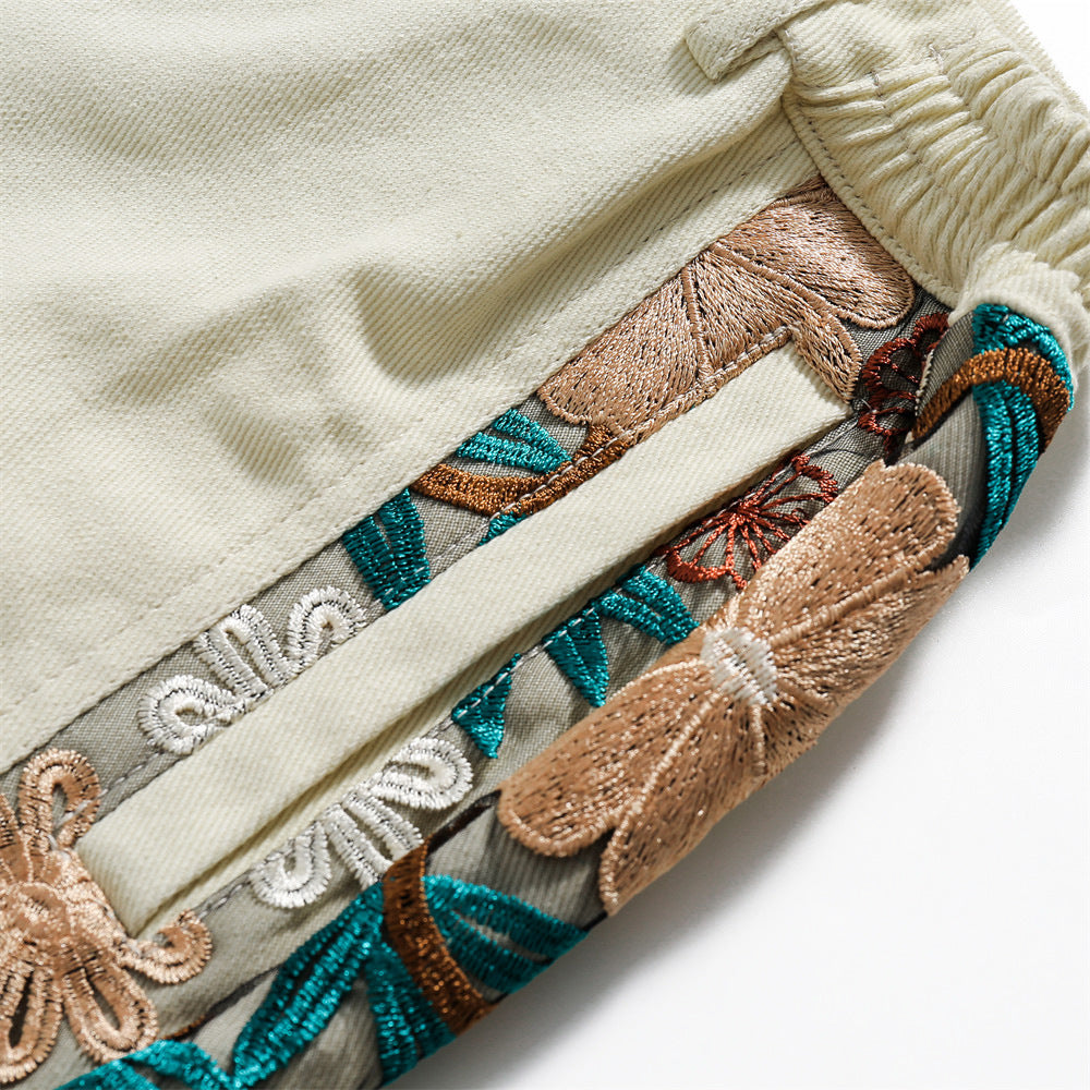 Geborduurde sportshorts met kant en stiksels
