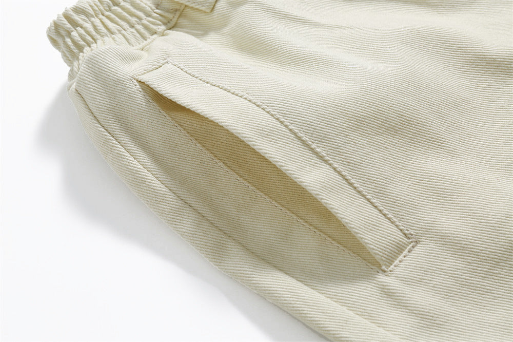 Geborduurde sportshorts met kant en stiksels