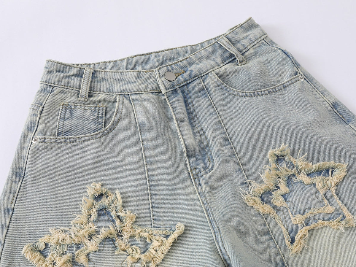 Jeans de pierna ancha con efecto desgastado y estrellas de Madxmarx