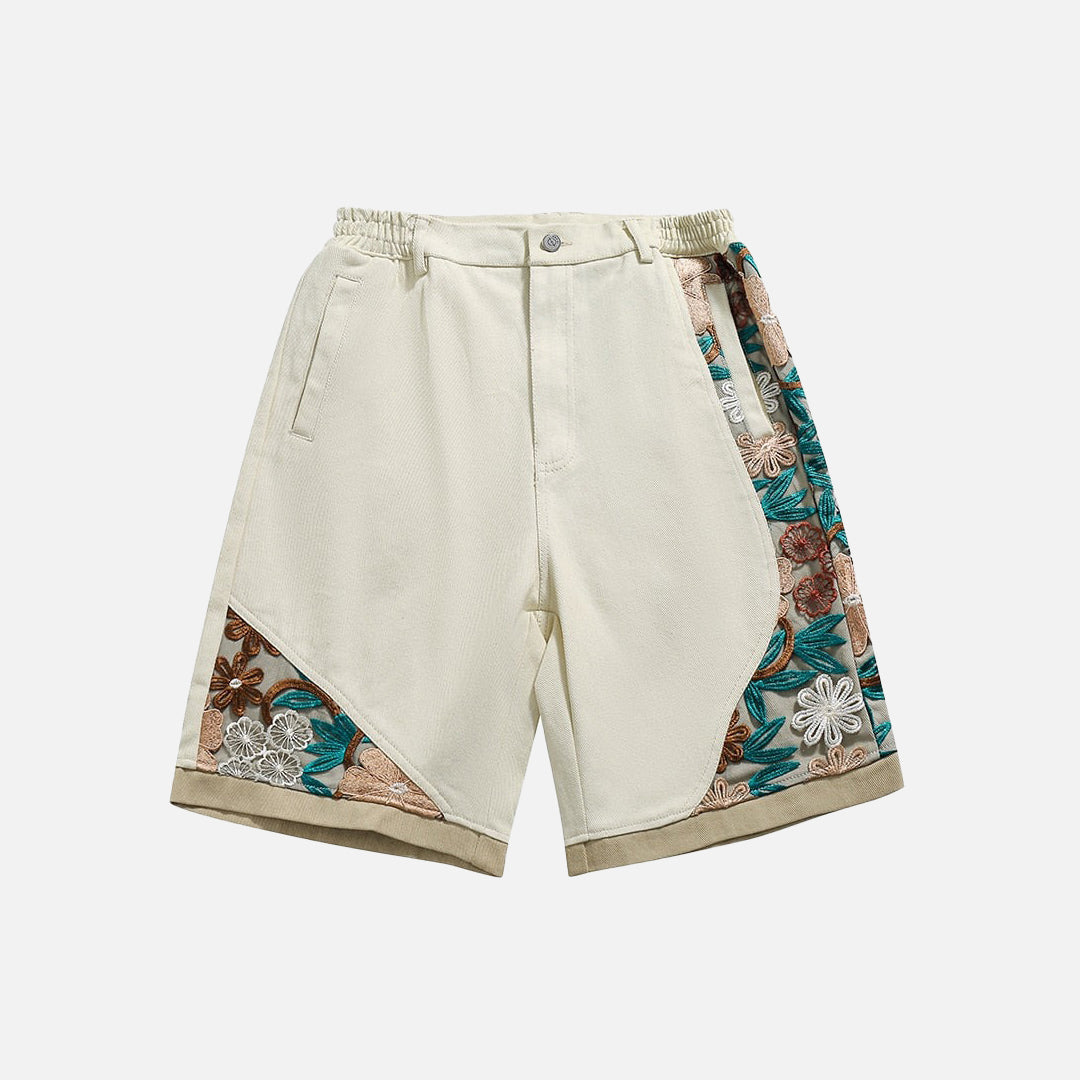 Pantaloncini di jeans con patchwork floreale