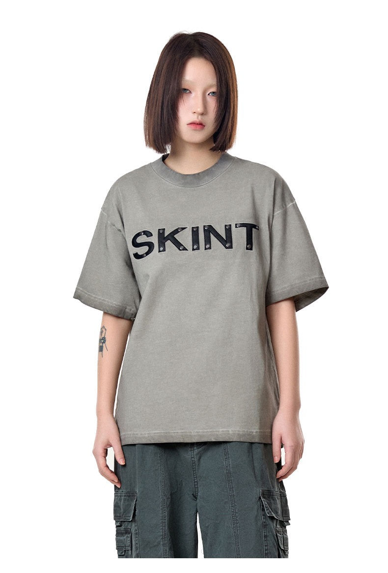 Camiseta vintage lavada “SKINT” de Madxmarx