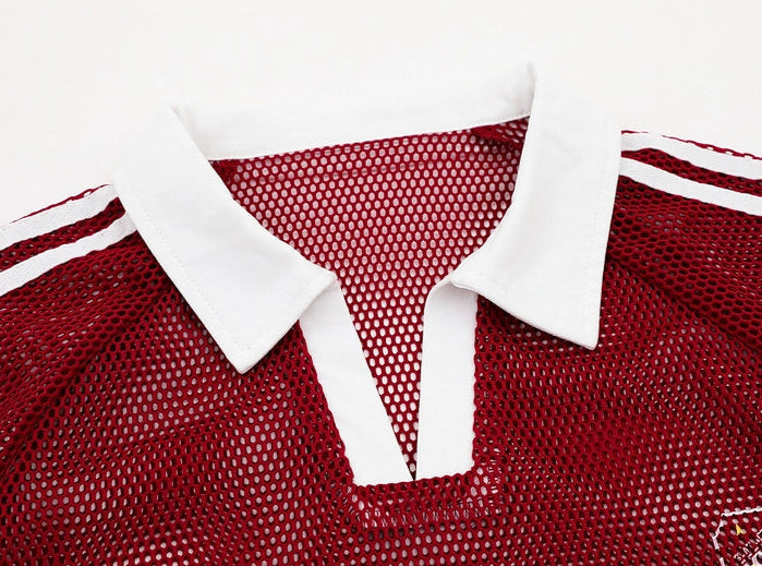 Red mesh fabric with white collar and text on a white background