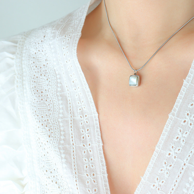 Women Wearing Silver Tone Opal Pendant Necklace, Delicate Snake Chain, Fashion Jewelry Trend, Minimalist Square Gemstone Necklace, Popular Gift for Women, Best Seller in Dainty Jewelry, Stylish Stacking Ring Set.