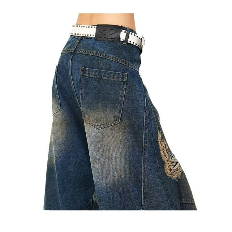 Jean délavé à jambes larges, déchiré et sale