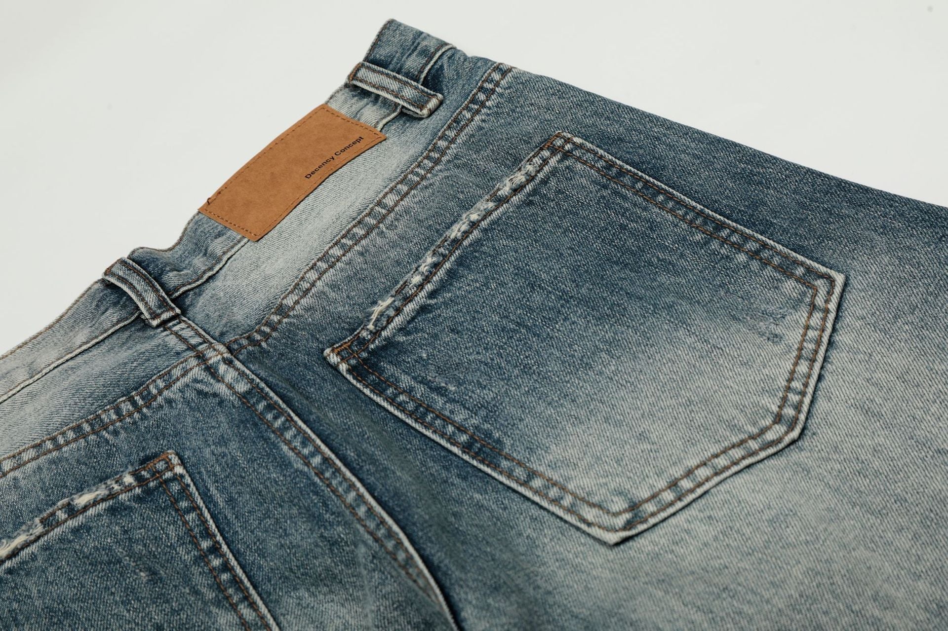 Washed Whisker Damage Curved Denim Jeans