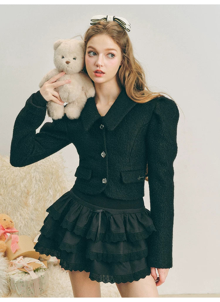 Chaqueta de lana con mangas abullonadas cortas y lazo