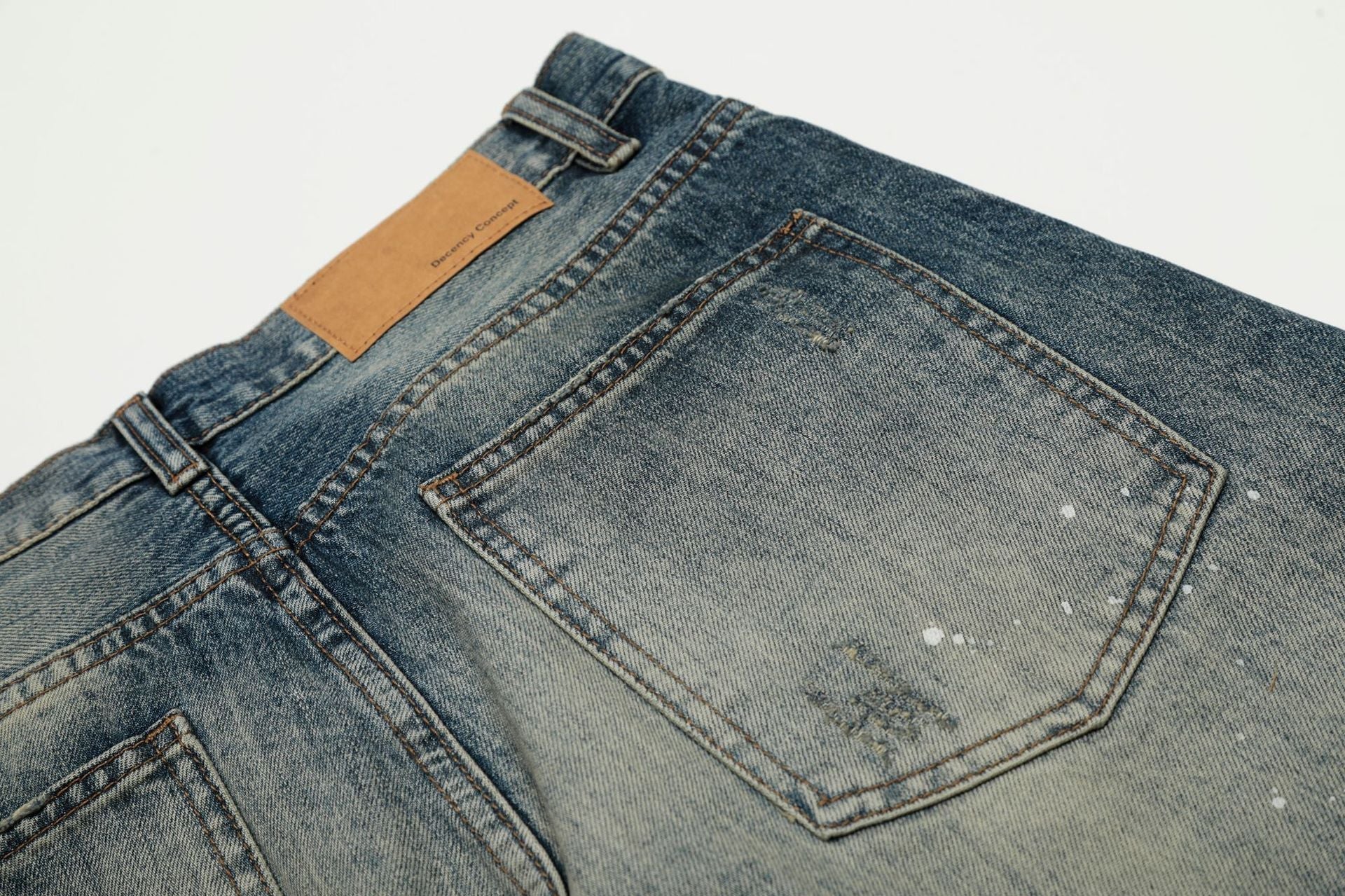 Washed Whisker Paint Splatter Curved Denim Jeans