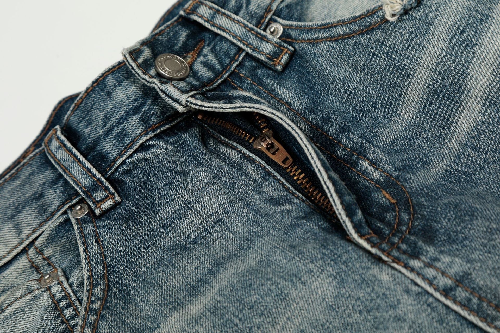 Washed Whisker Damage Curved Denim Jeans