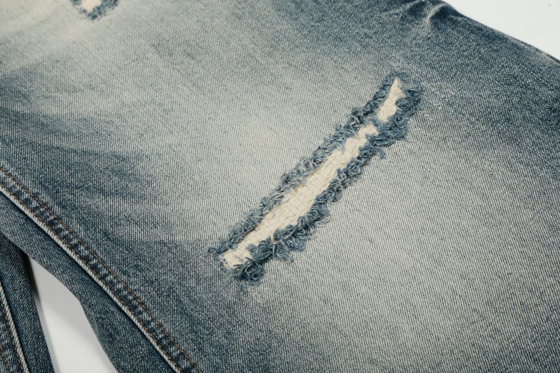 Washed Whisker Damage Curved Denim Jeans