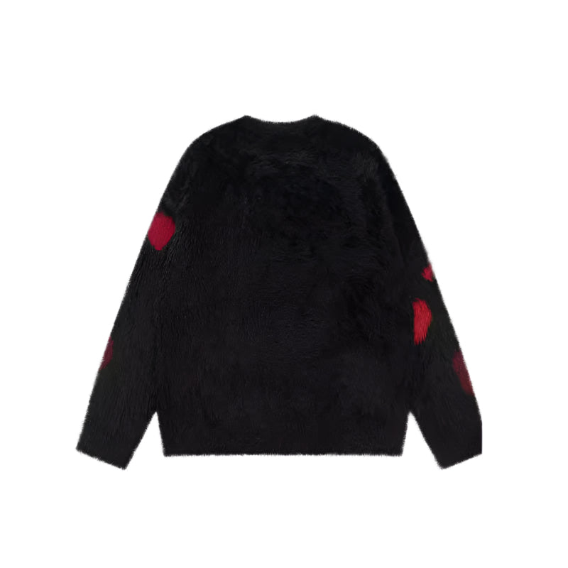 Pull en tricot rose dégoulinant
