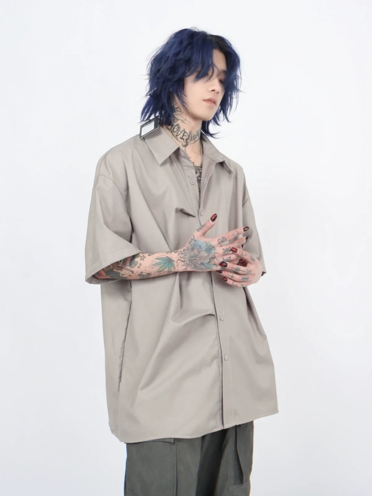 Camicia oversize a maniche corte con pieghe
