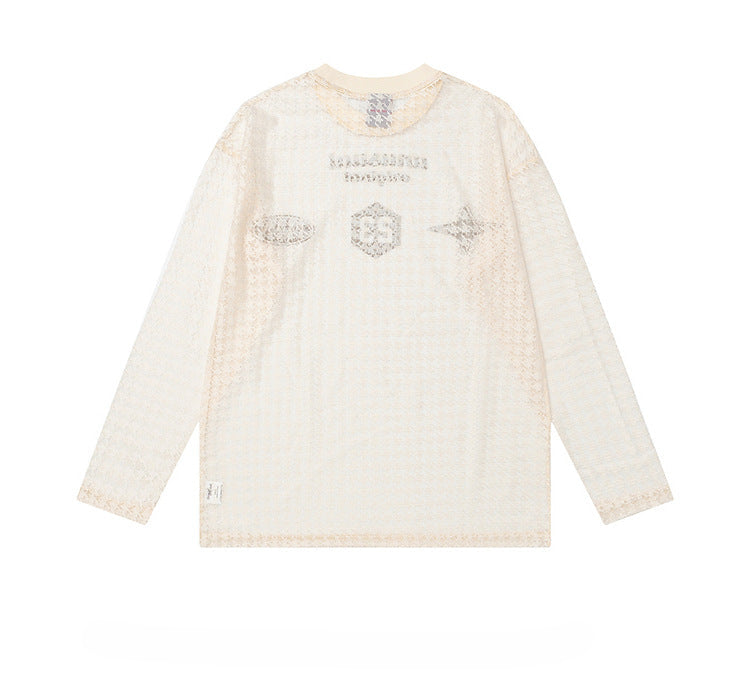White long-sleeve shirt with decorative patterns on a white background