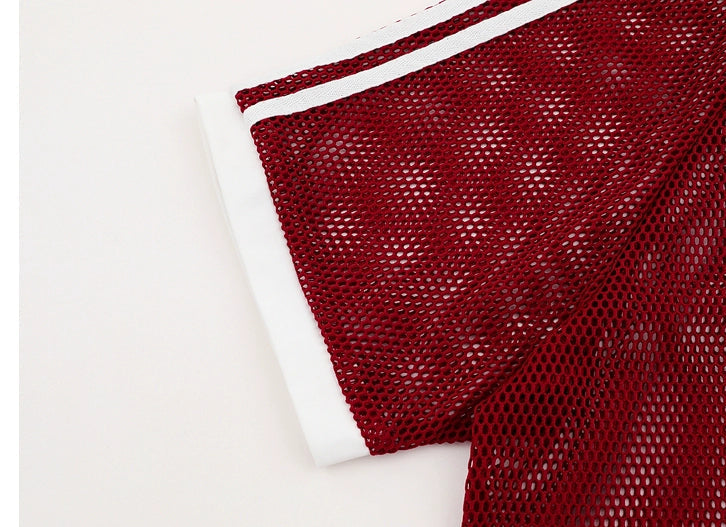 Red mesh fabric with white trim on a light gray background