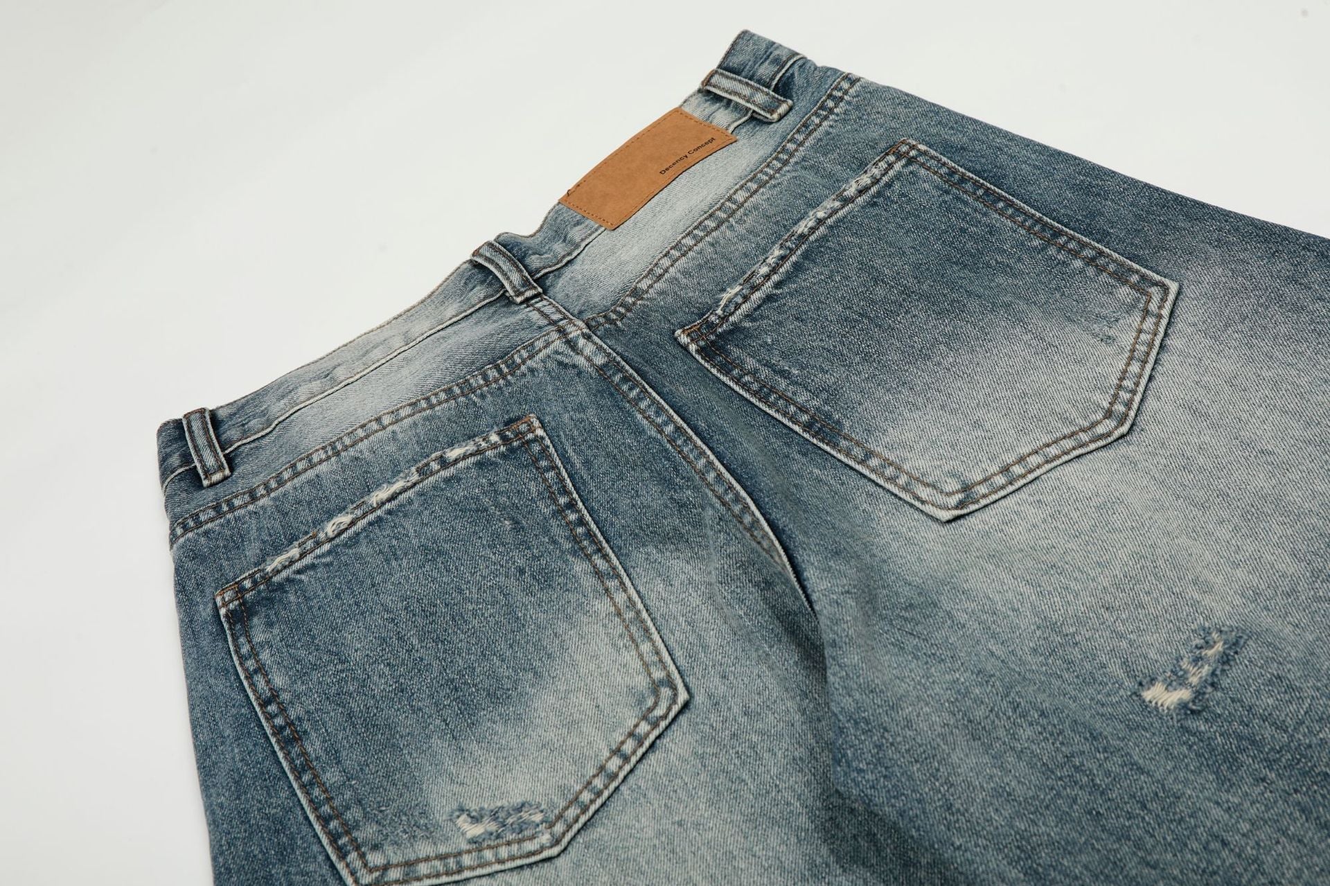 Washed Whisker Damage Curved Denim Jeans