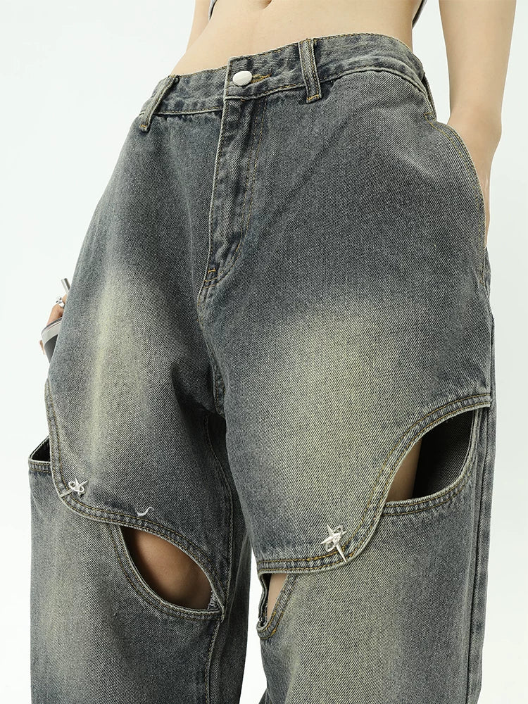 Jean en jean avec décoration à boutons métalliques et design ajouré