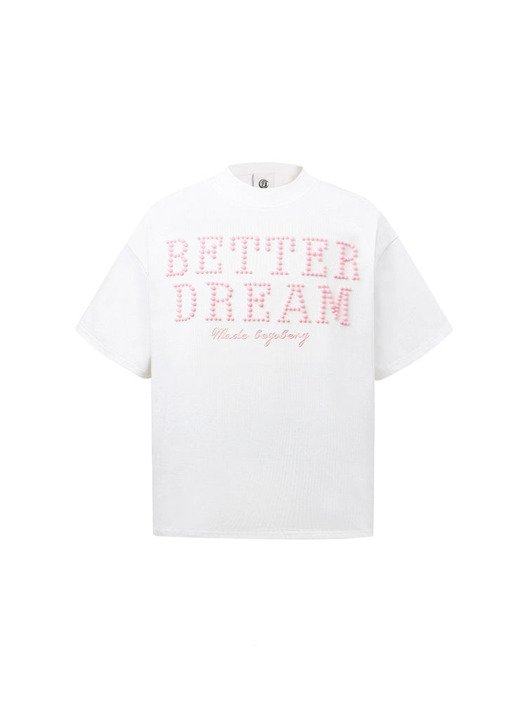 White t-shirt with pink text on a white background
