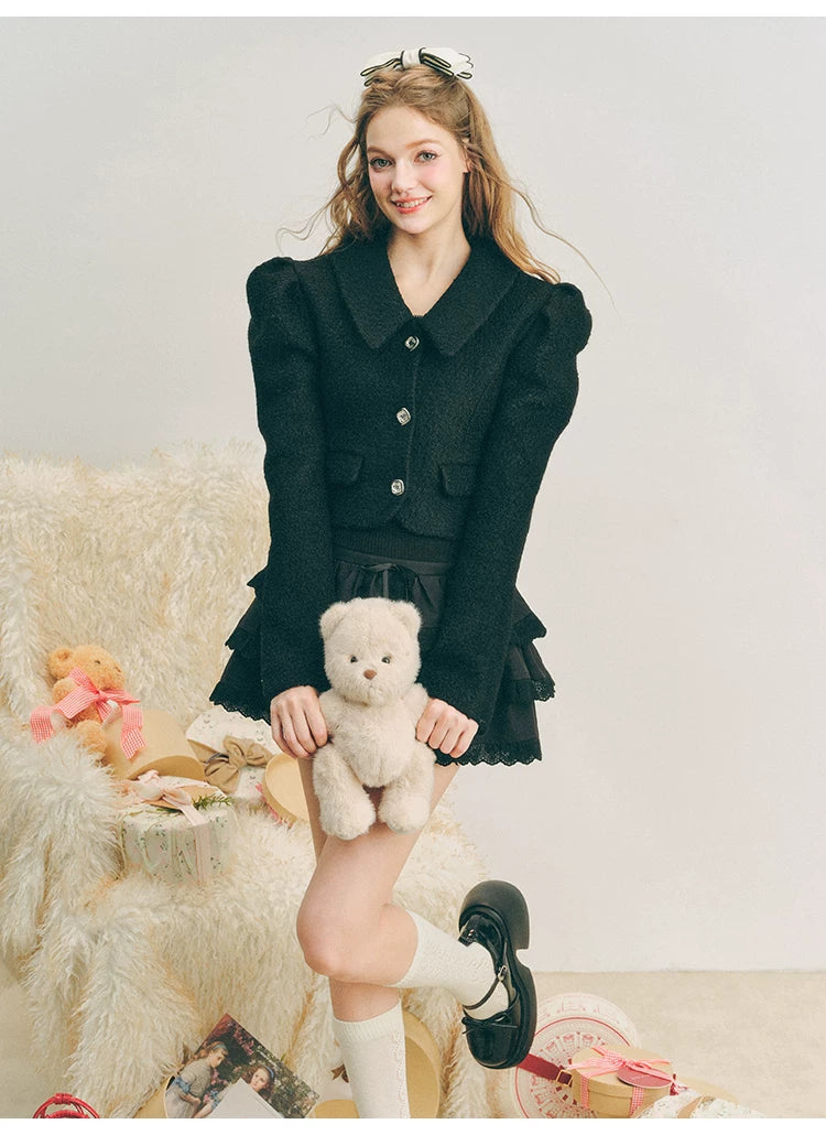 Chaqueta de lana con mangas abullonadas cortas y lazo