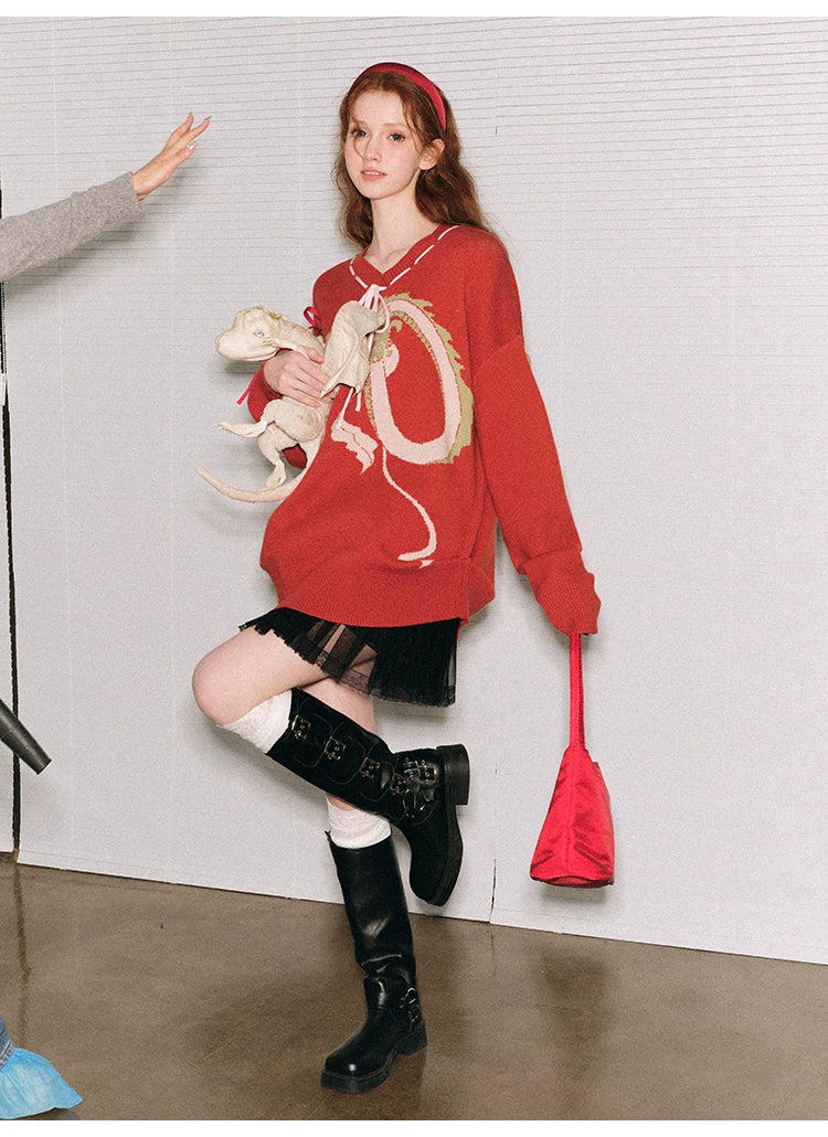 Suéter de punto extragrande con diseño de dragón y lazo