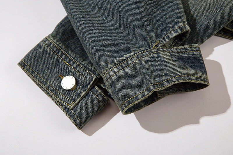 Veste courte en jean avec boucle en métal papillon