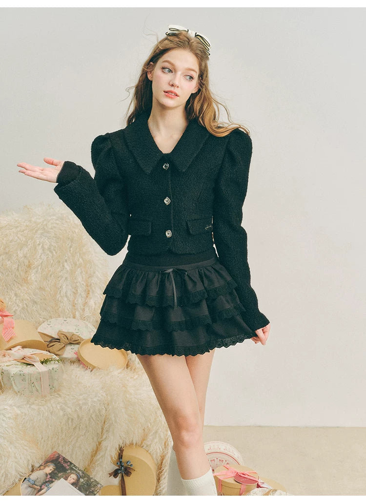 Chaqueta de lana con mangas abullonadas cortas y lazo
