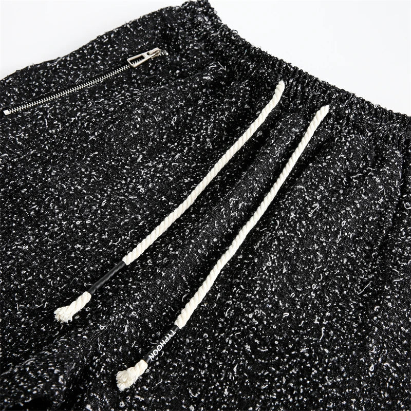 Moderne gespikkelde trekkoordshorts