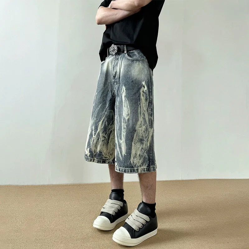 Pantaloncini in denim con stampa grafica a fiamme