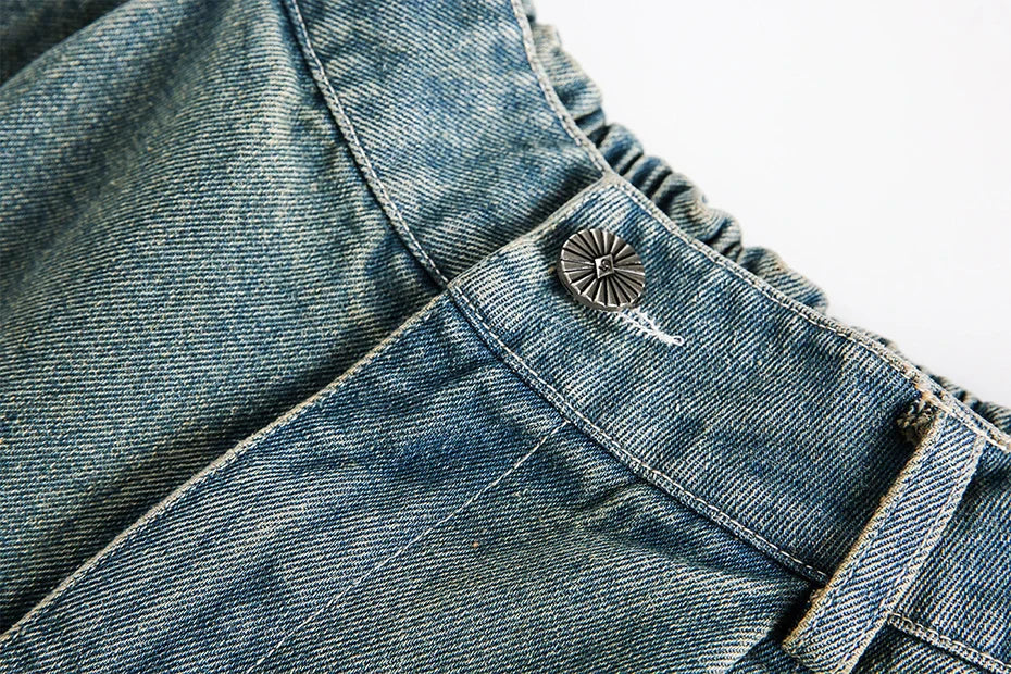 Pantaloncini in denim con stampa divina