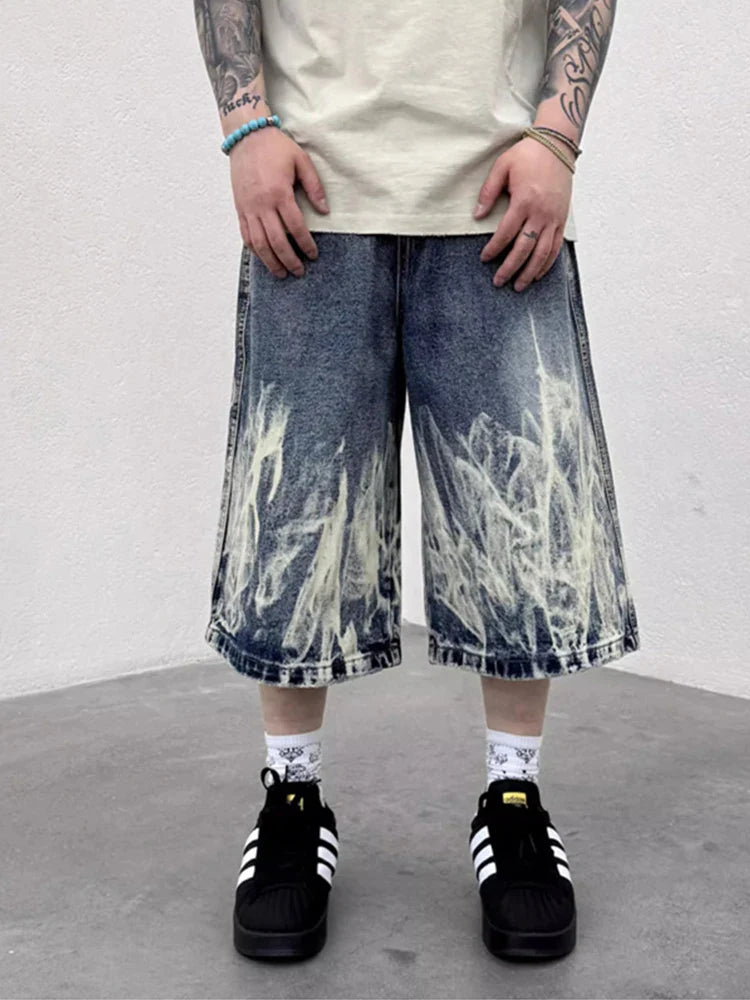 Pantaloncini in denim con stampa grafica a fiamme