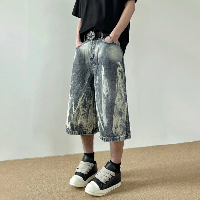 Pantaloncini in denim con stampa grafica a fiamme