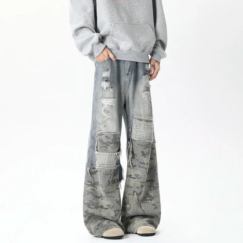 Calça Jeans Larga com Patchwork Estiloso de Camuflagem e Detalhes Rasgados - Azul / S
