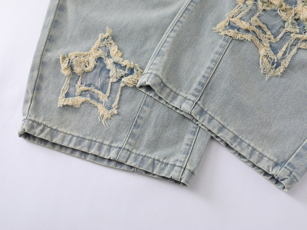 Jeans de pierna ancha con efecto desgastado y estrellas de Madxmarx
