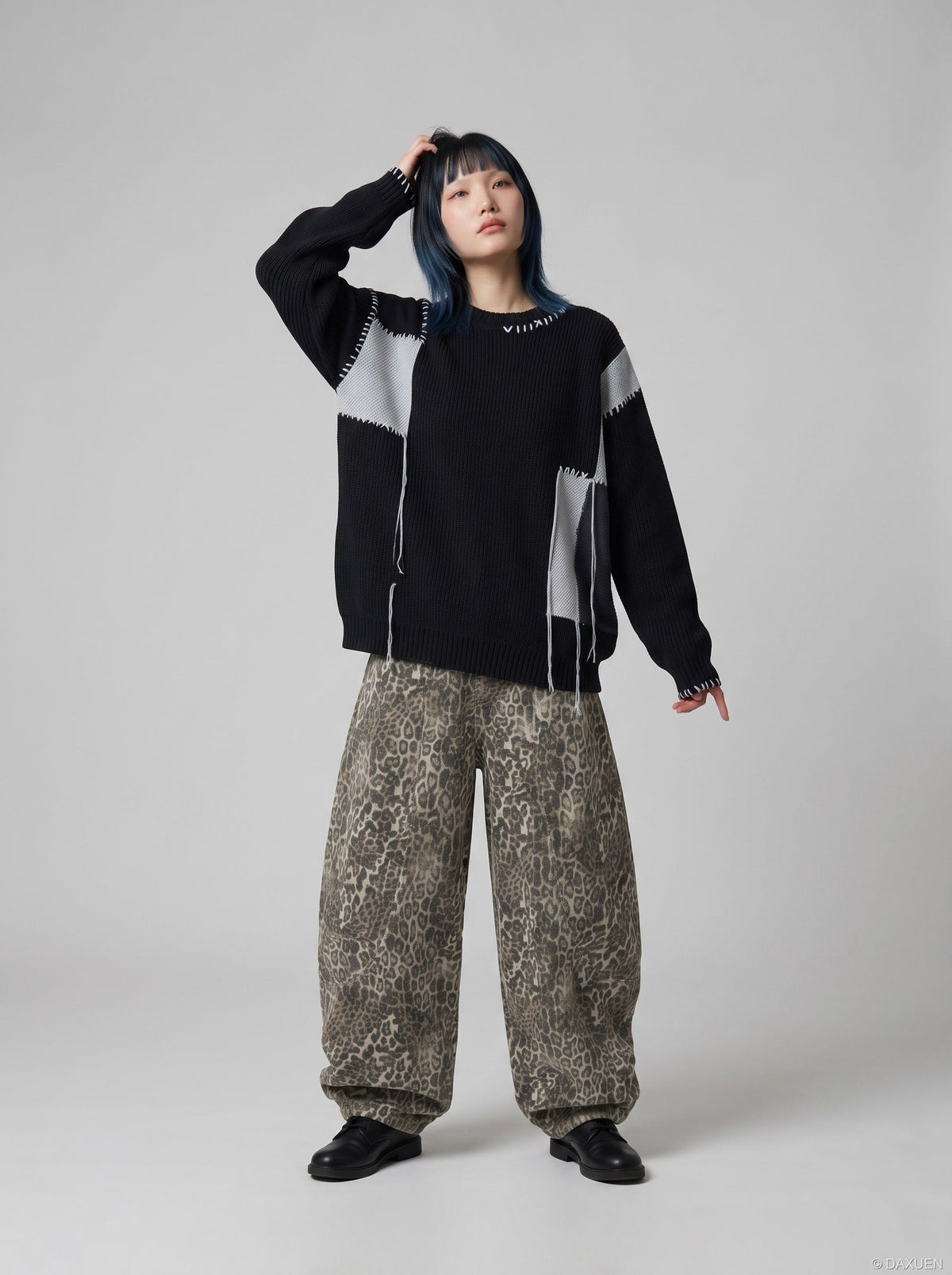 DAXUEN black oversized patchwork knit sweater — model photo