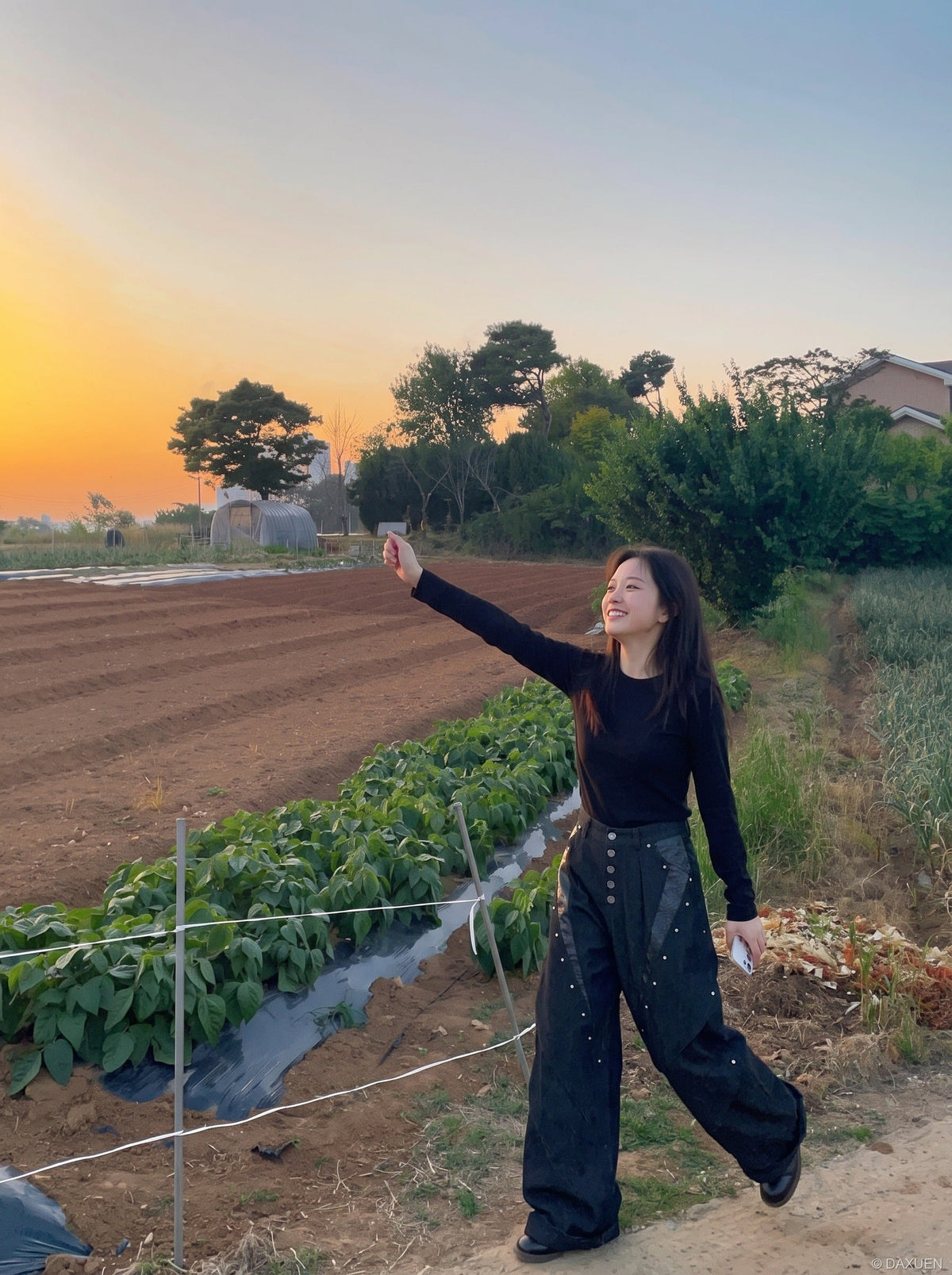 DAXUEN black angular crocodile-panel trousers — model photo