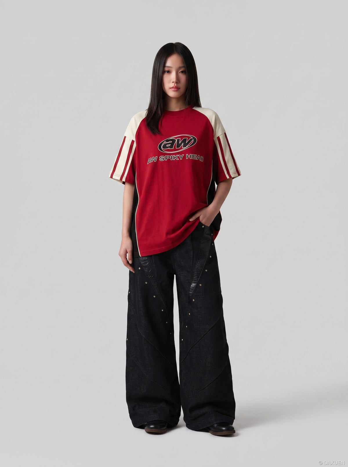 DAXUEN black angular crocodile-panel trousers — model photo
