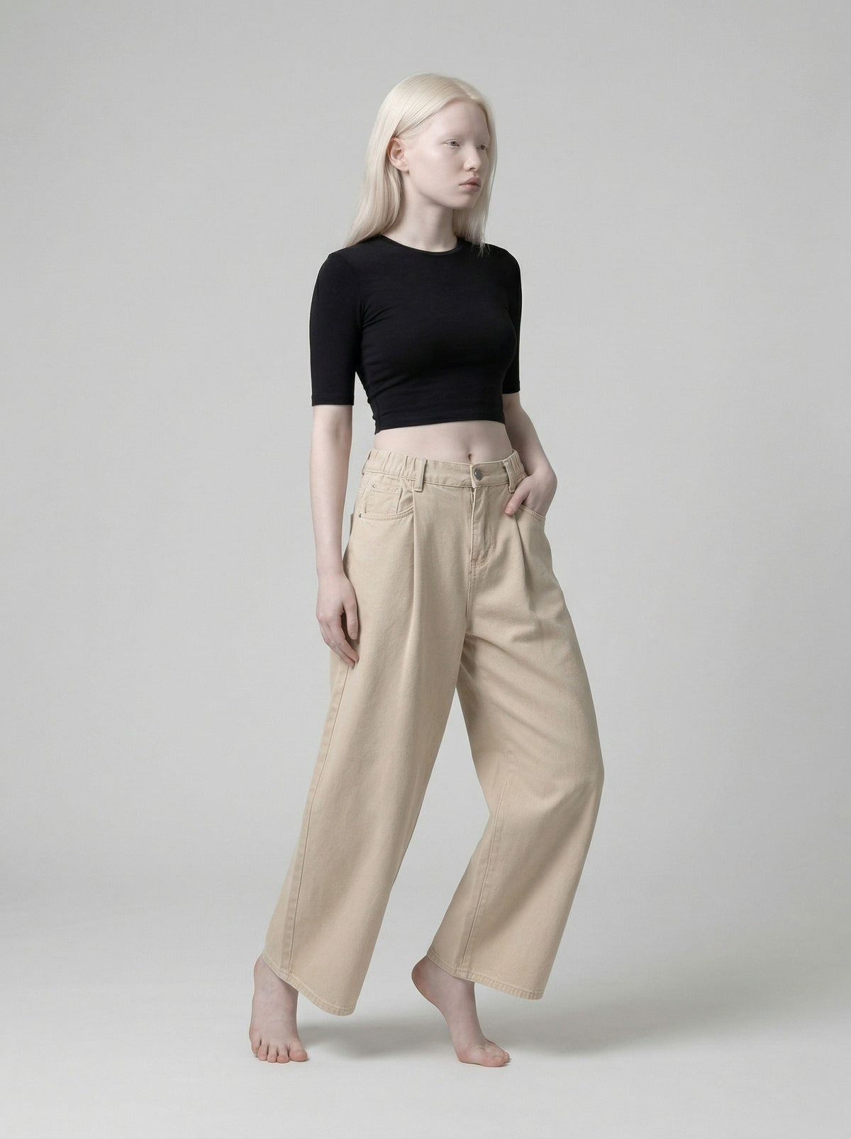 DAXUEN Beige high-waisted wide leg trousers — model photo