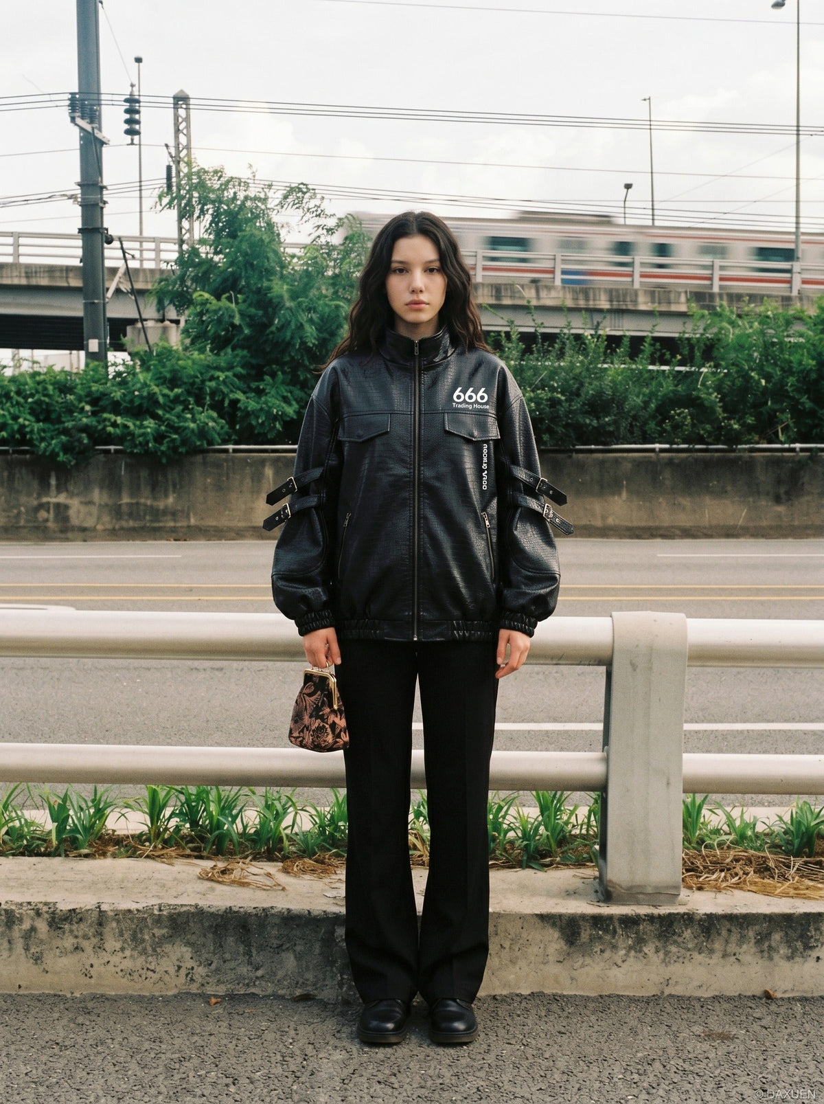 DAXUEN black crocodile-embossed faux leather jacket — model photo