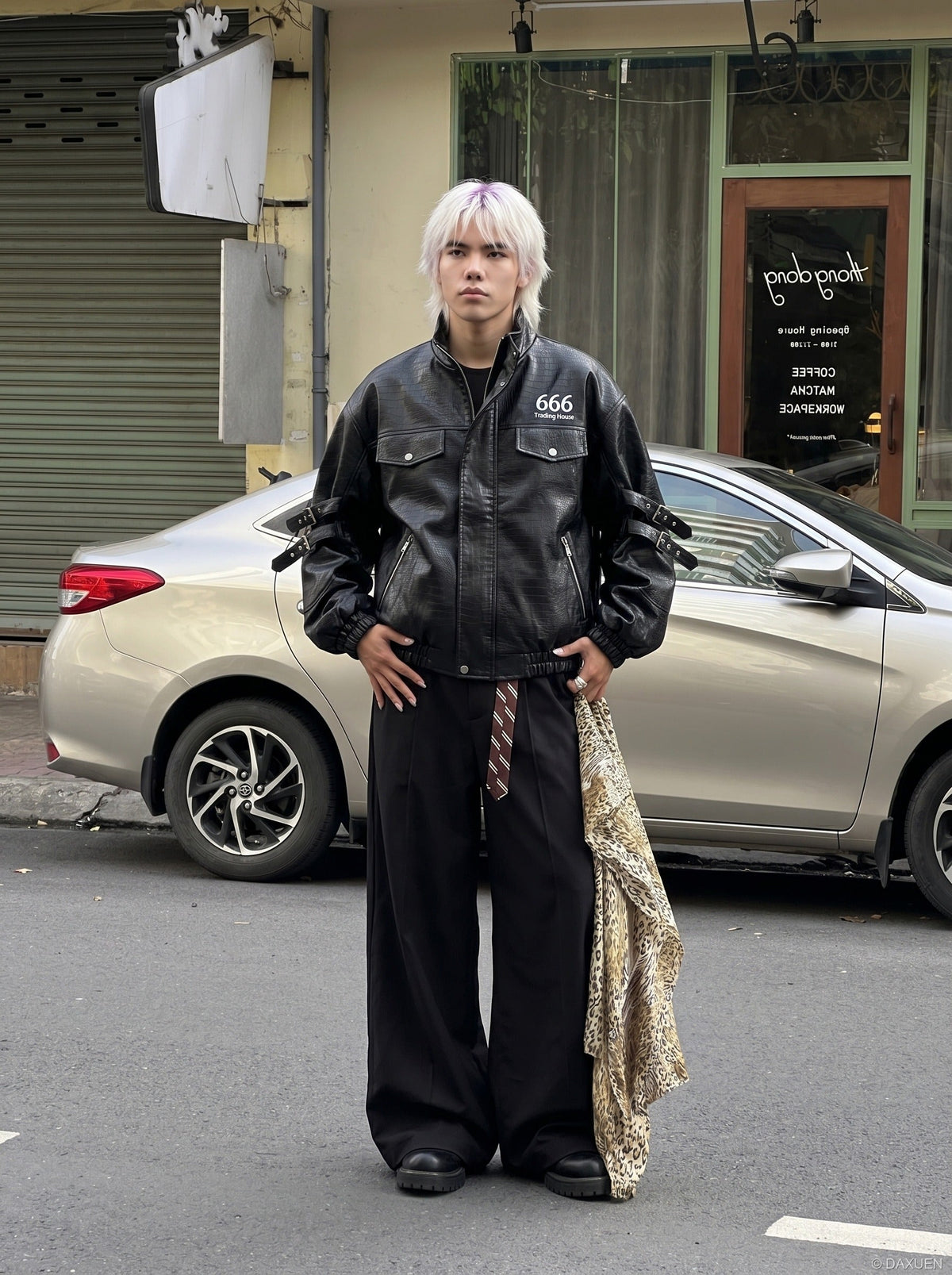 DAXUEN black crocodile-embossed faux leather jacket — model photo