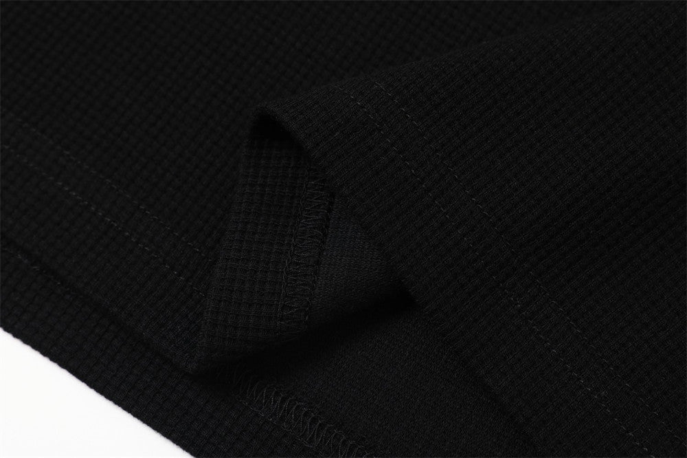 DAXUEN black mock neck pullover with bold wavy graphics