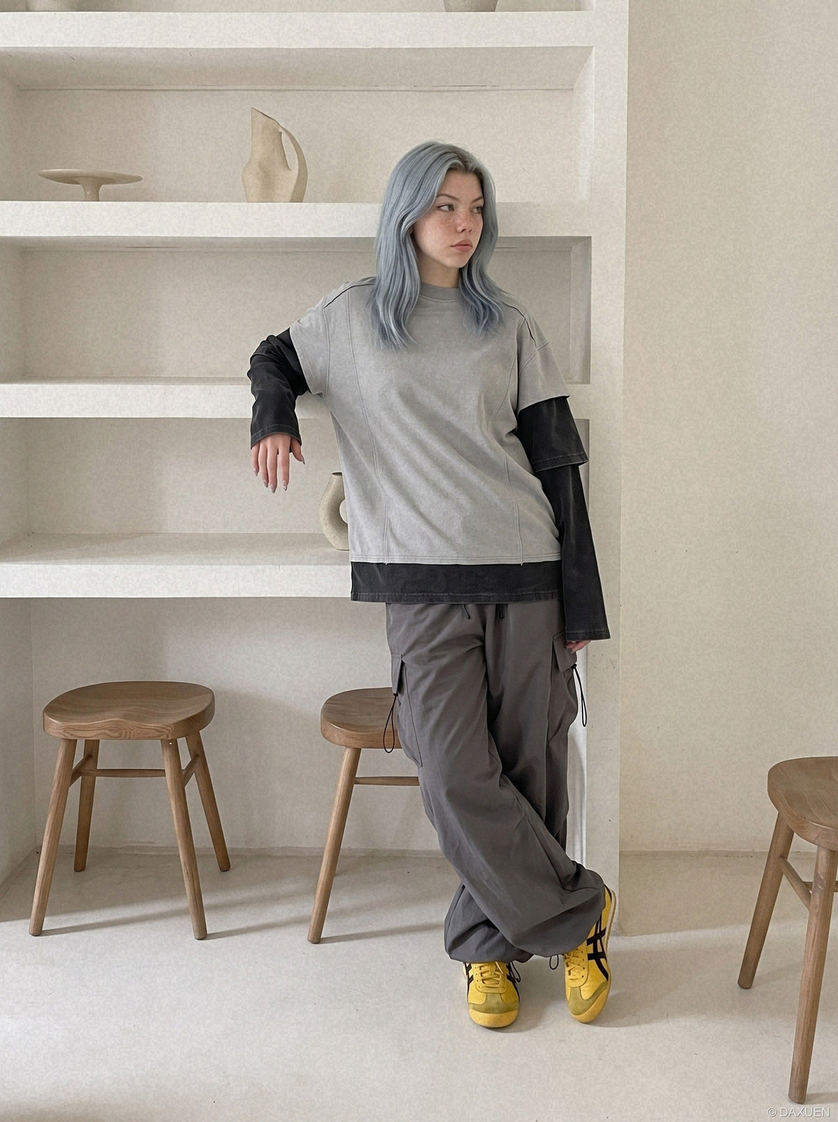 DAXUEN grey oversized faux-layered mock neck top — model photo