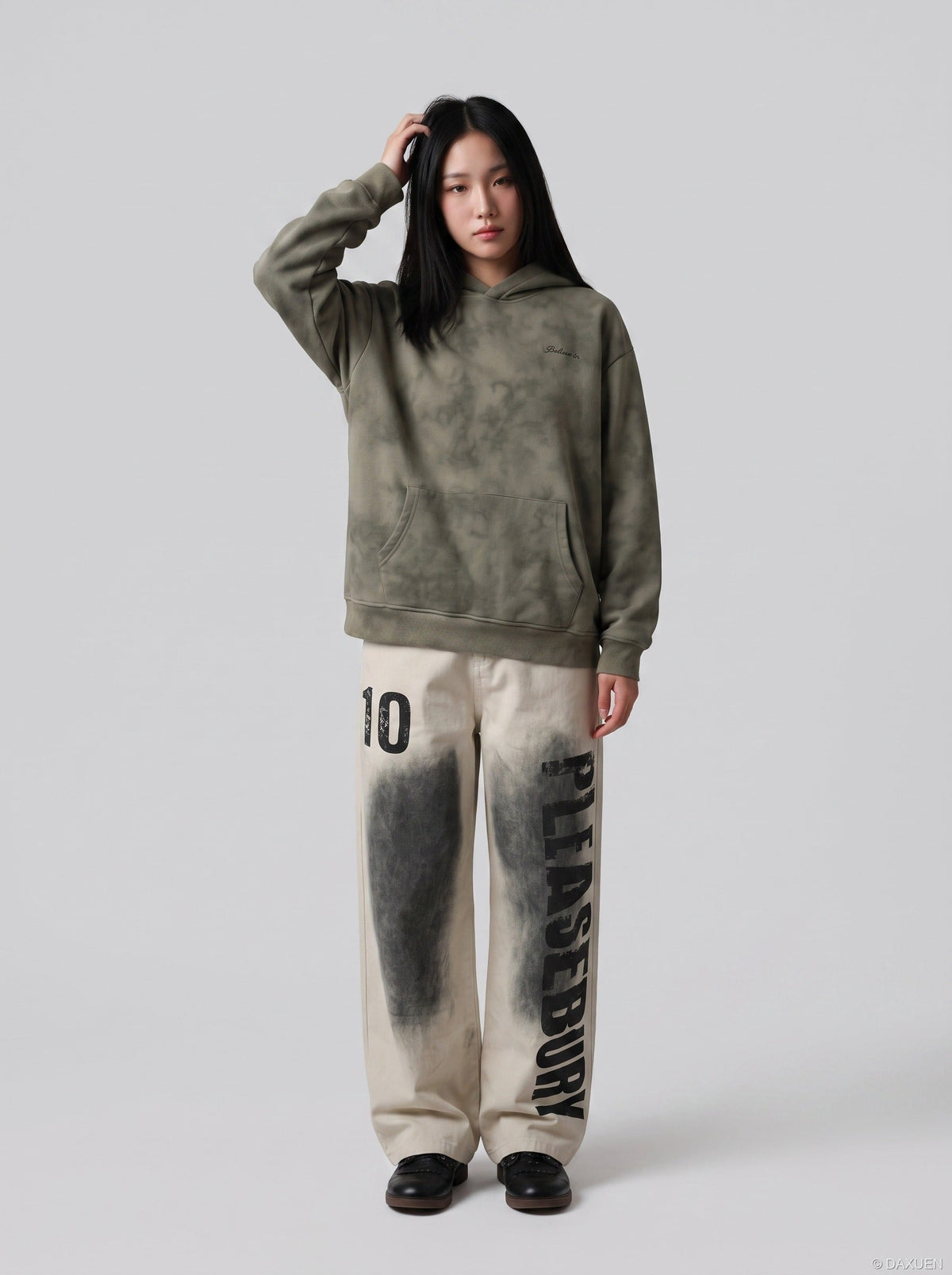 DAXUEN light beige distressed number 10 wide-leg pants — model photo