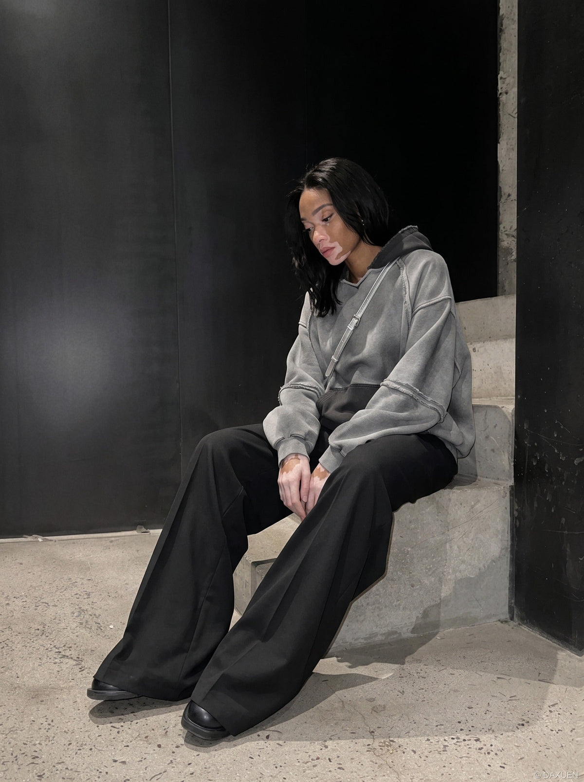 DAXUEN distressed oversized two-tone hoodie sweatshirt — model photo