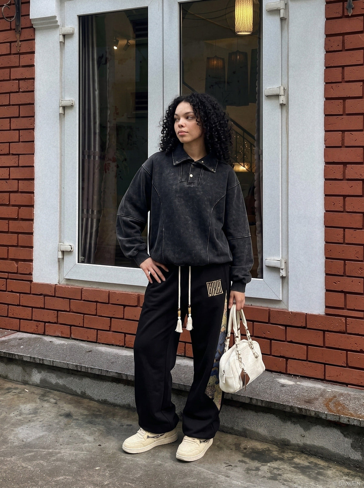 DAXUEN faded black acid-wash long-sleeve sweatshirt — model photo