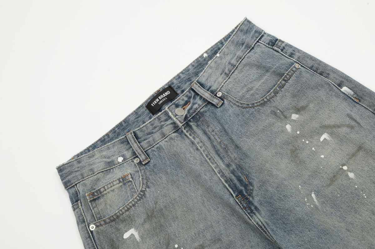 Jean large bleu délavé à éclaboussures de peinture