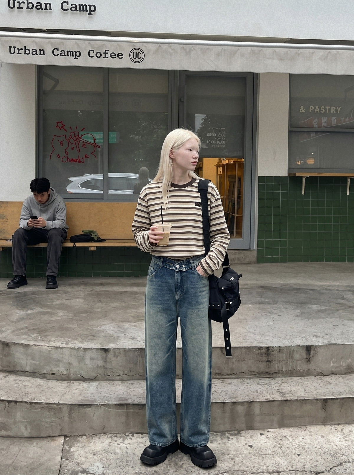 DAXUEN faded blue wide-leg denim trousers — model photo
