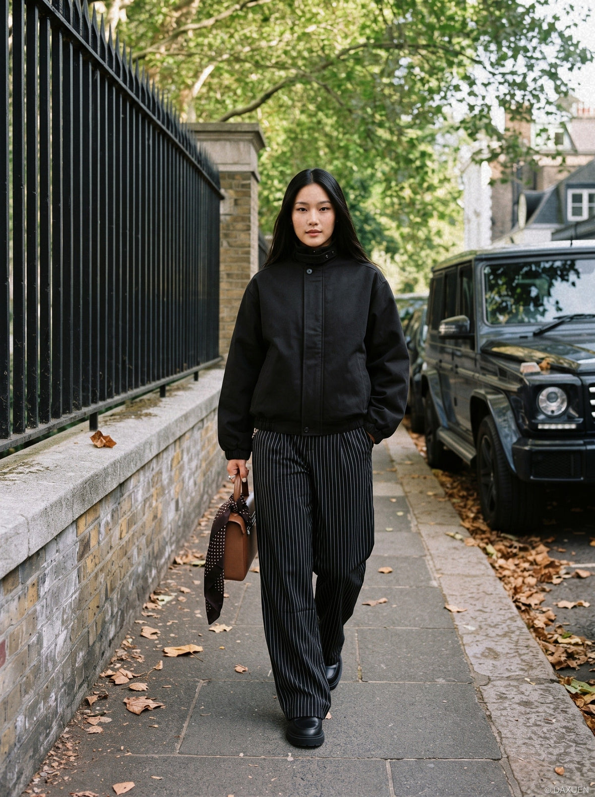 DAXUEN black oversized high-collar bomber jacket — model photo
