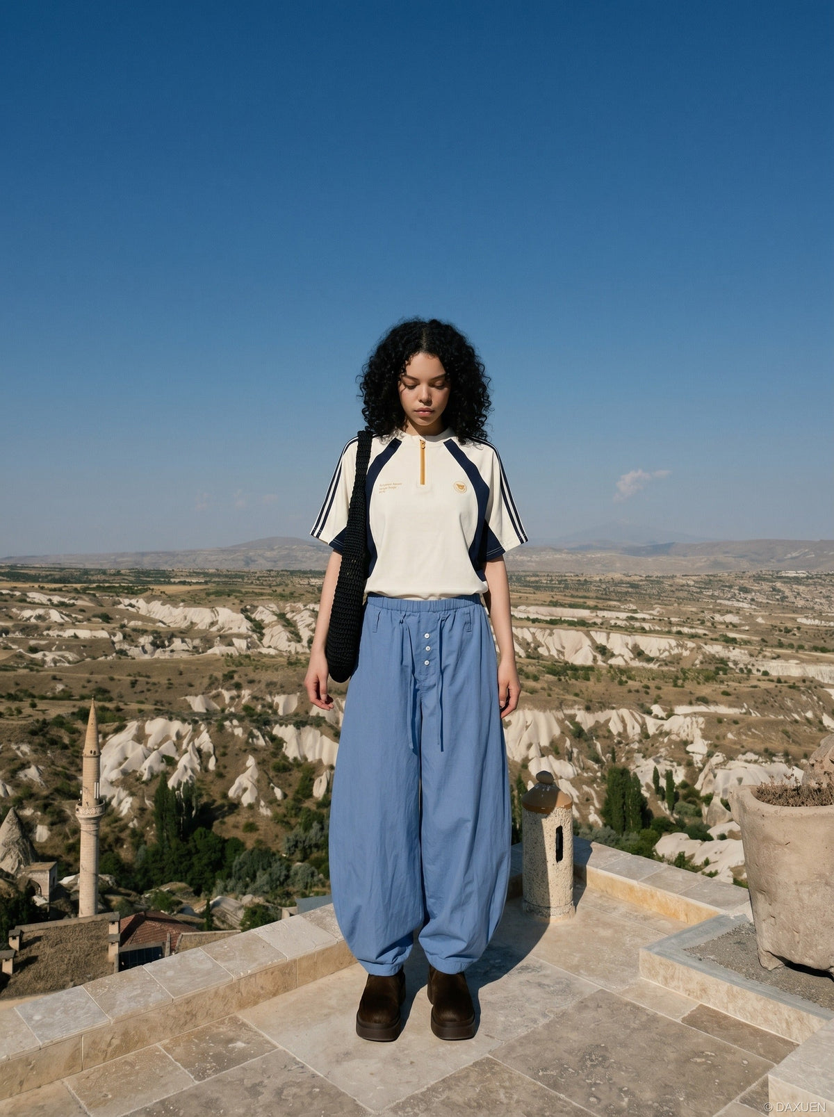 DAXUEN light blue balloon pants with button placket — model photo